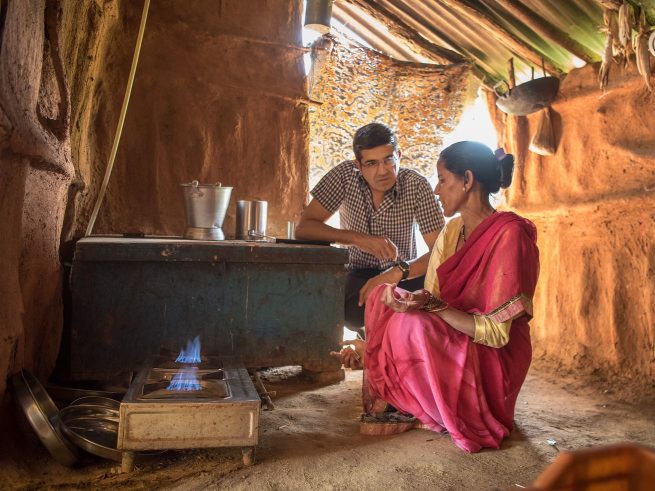Woman and man with cookstove